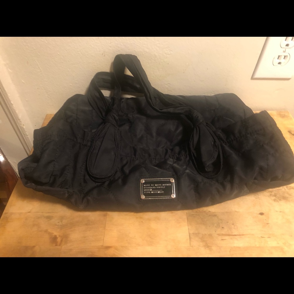 Tote bag has lots of room ..one pocket w zipper very secure